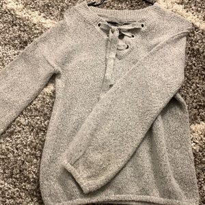 “By Design” Grey Sweatshirt.